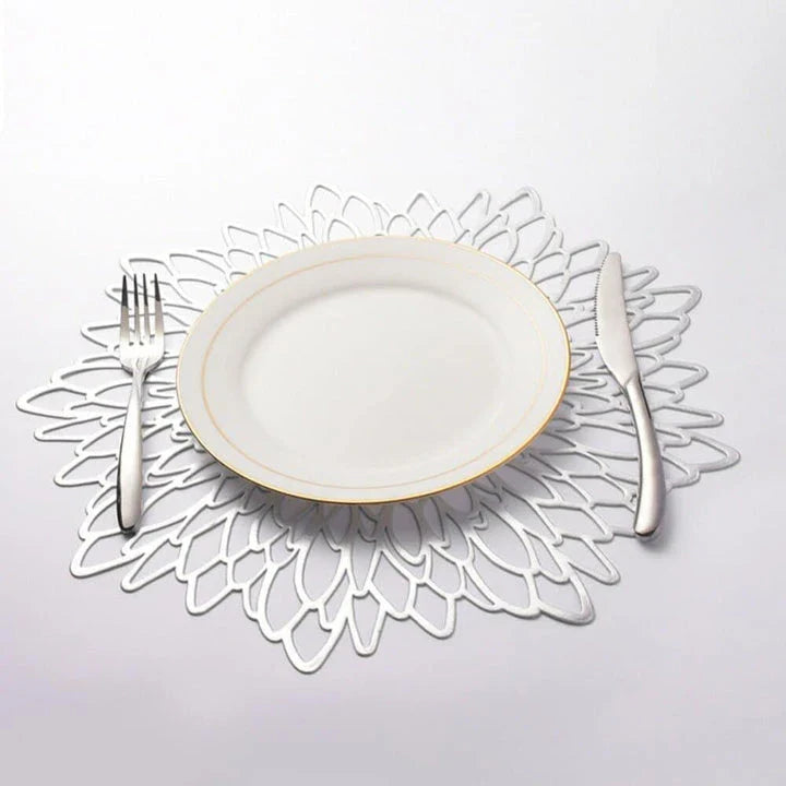 Elegant floral-patterned PVC dining table coaster in a contemporary setting, protecting a wooden table surface
