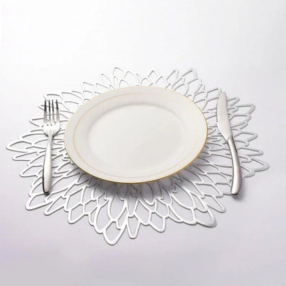 Elegant floral-patterned PVC dining table coaster in a contemporary setting, protecting a wooden table surface