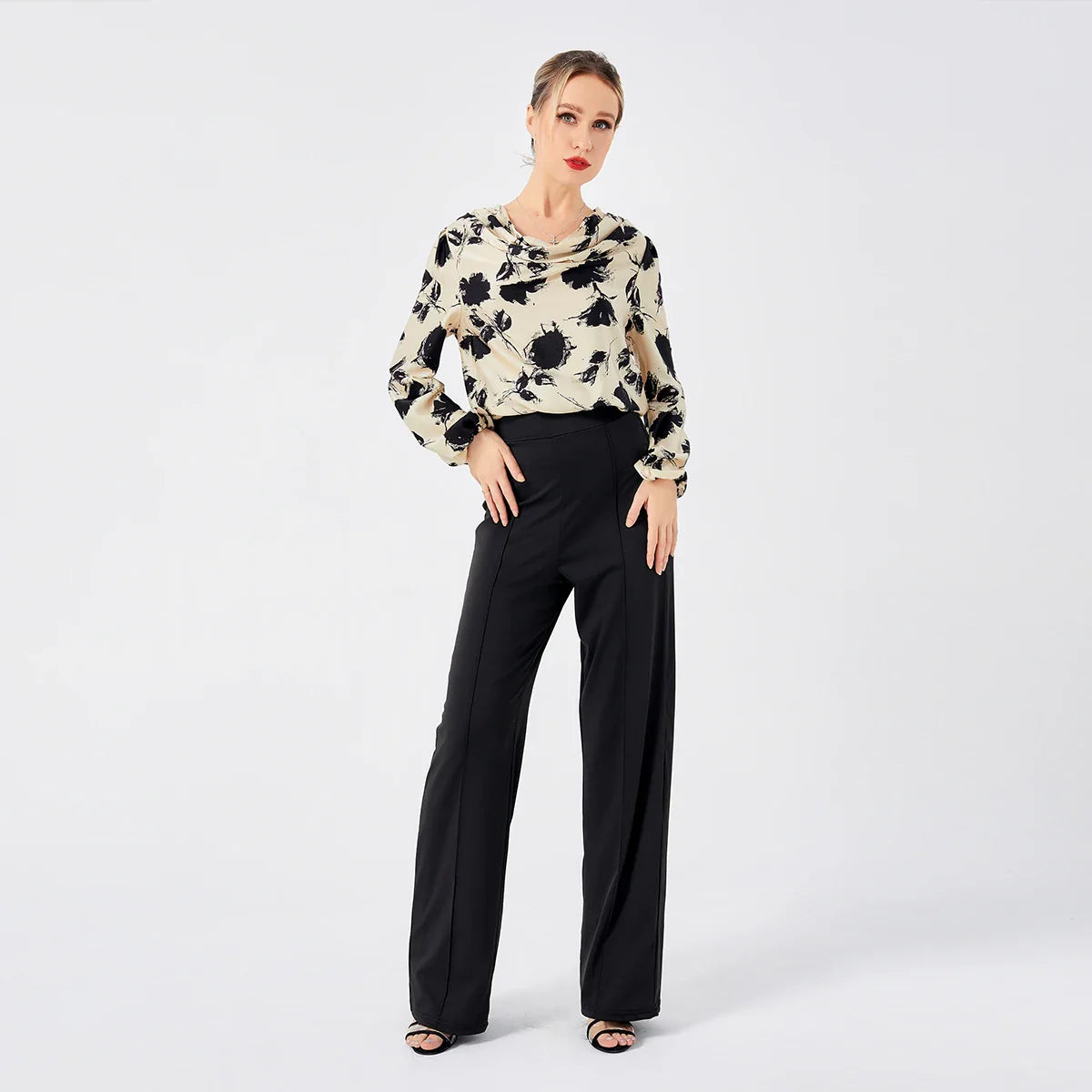 Elegant ladies' blouse with a printed pattern, dropped collar, and long sleeves in a classic white colour