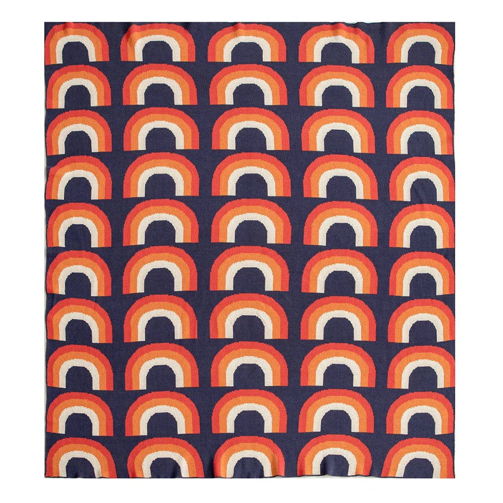 Cosy rainbow-patterned cotton knit throw blanket in various plaid and stripe designs, showcasing vibrant colours and a soft, comfortable texture.