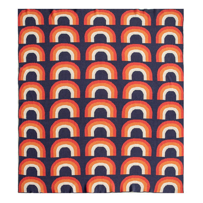 Cosy rainbow-patterned cotton knit throw blanket in various plaid and stripe designs, showcasing vibrant colours and a soft, comfortable texture.