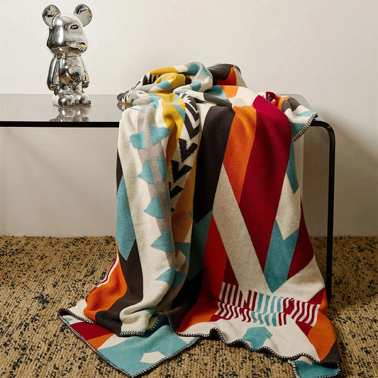 Cosy bohemian-style cotton blanket with vibrant geometric pattern, suitable for indoor and outdoor use