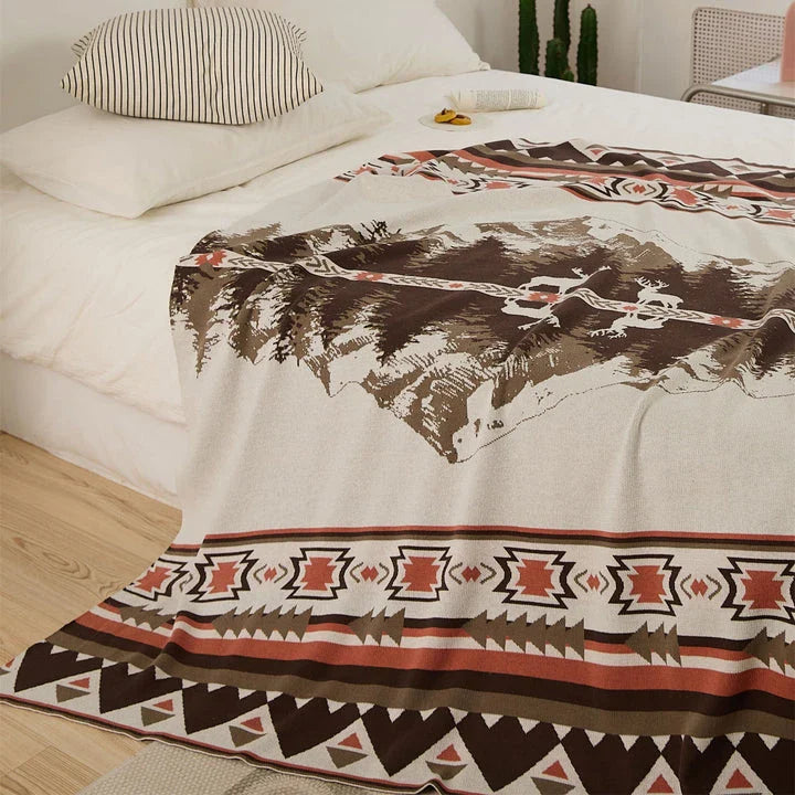 Elegant throw blanket with a captivating design of an elk standing in a mountain forest, reflected in the calm waters
