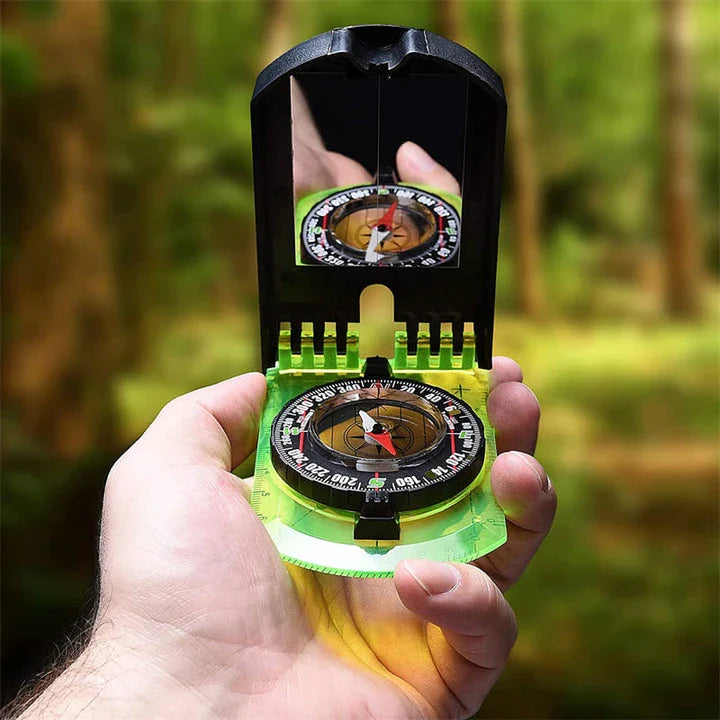 Multifunctional outdoor compass with scale, map ruler, mirror, and durable yellow casing for reliable navigation in the wilderness