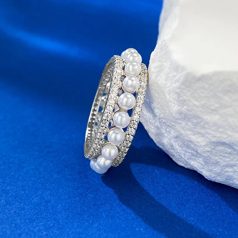 A beautiful 925 sterling silver ring with a delicate pearl accent, designed for the discerning British woman