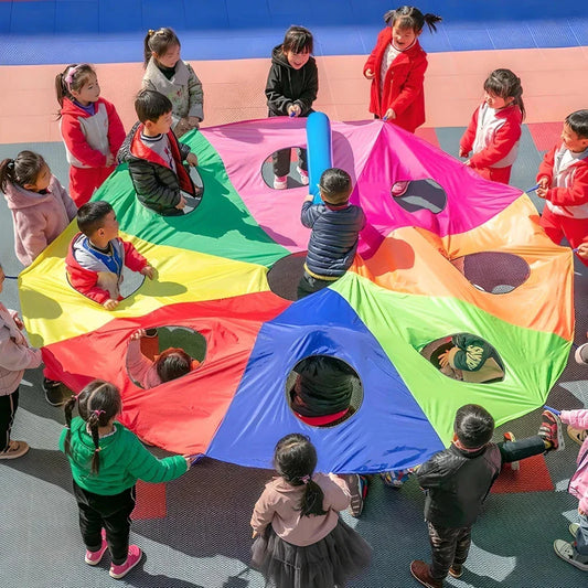 Vibrant rainbow-coloured parachute game for group play, promoting teamwork and skill development