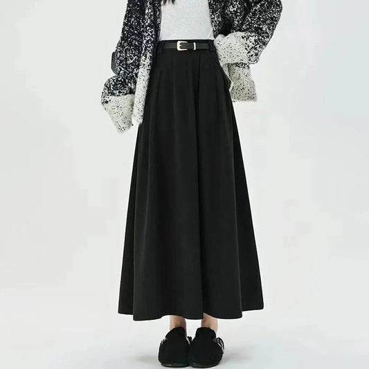 Elegant high-waisted pleated maxi skirt for stylish British women, featuring a classic A-line silhouette and solid colour design