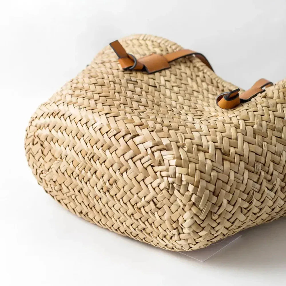 Elegant woven wicker basket bag in brown, perfect for summer adventures and carrying essentials
