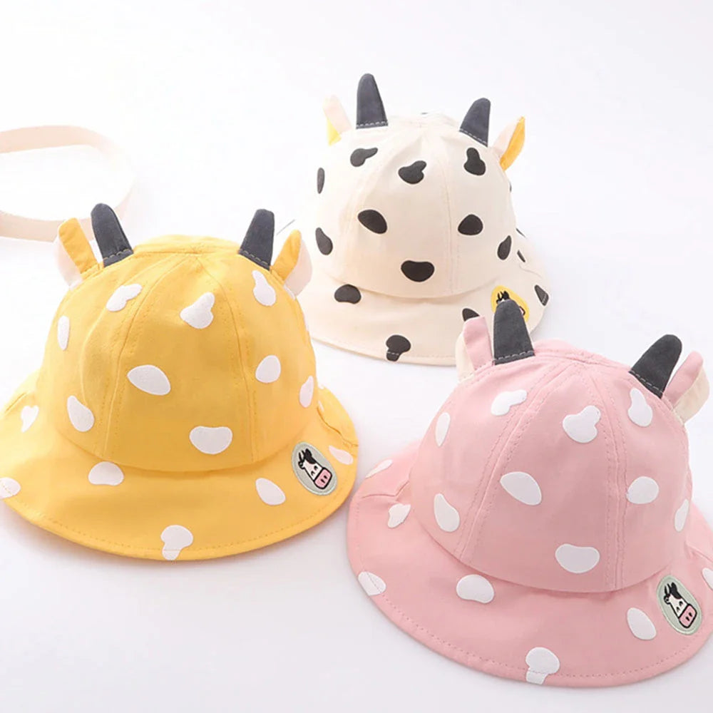 Adorable cow-patterned kids' bucket hat made of soft, breathable cotton for comfortable outdoor wear