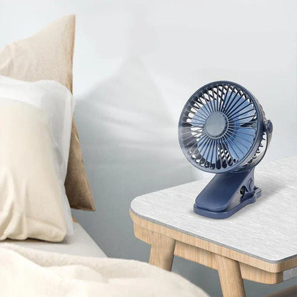 Portable Mini Hand Clip Fan with adjustable wind speed, 360° rotation, and USB rechargeable design for instant cooling relief