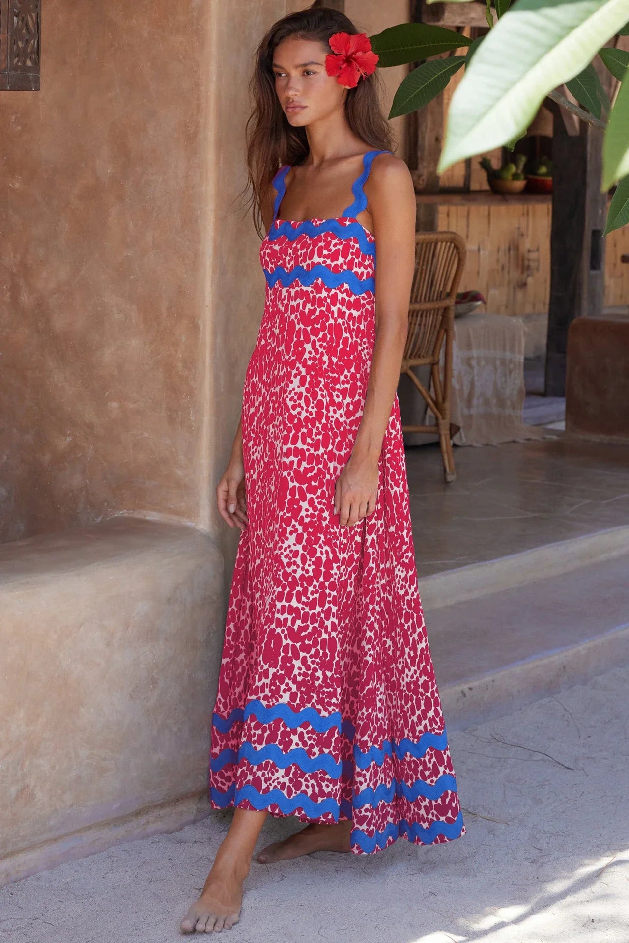 Elegant floral print suspender midi dress in black, perfect for summer beach holidays in the UK