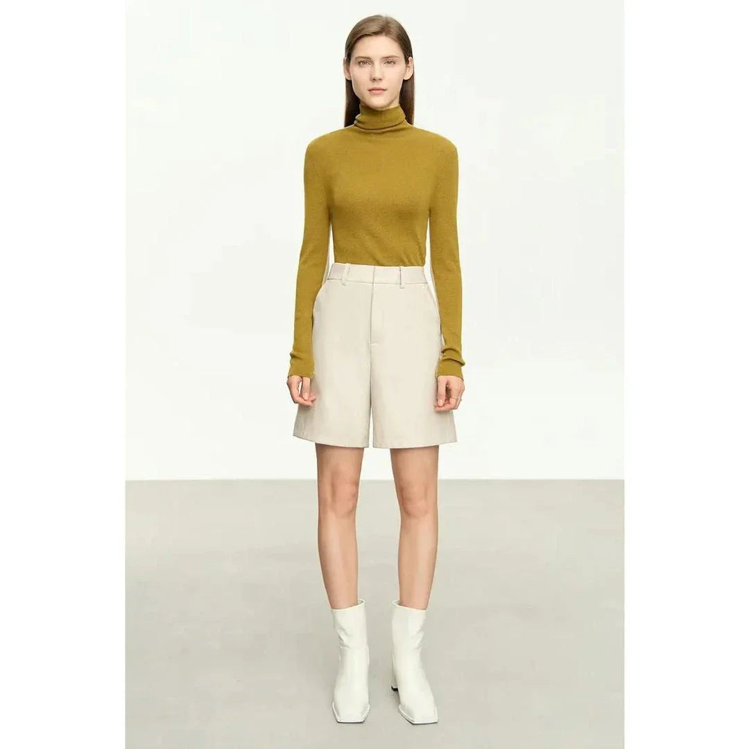 A cosy and stylish turtleneck sweater with a unique patchwork design, made from a premium wool blend for exceptional comfort and elegance.