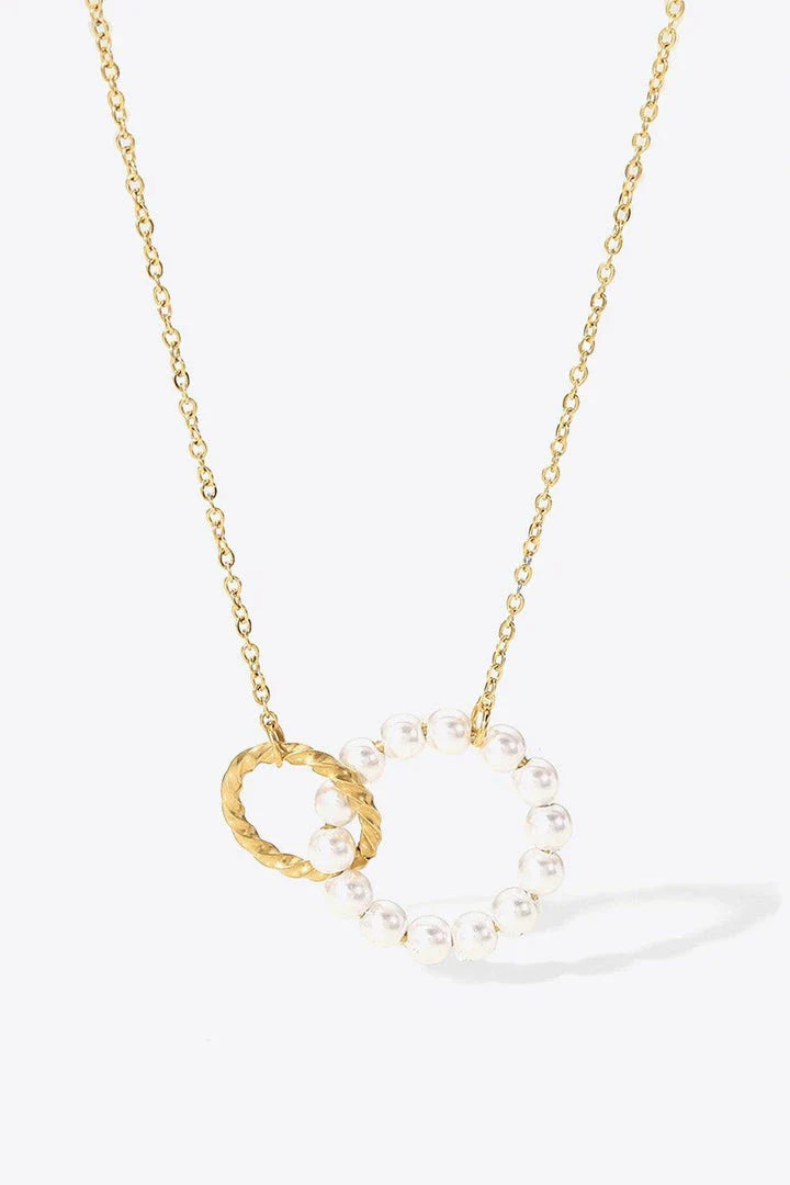 Elegant 18K gold-plated pearl hoop necklace with a lustrous synthetic pearl centrepiece