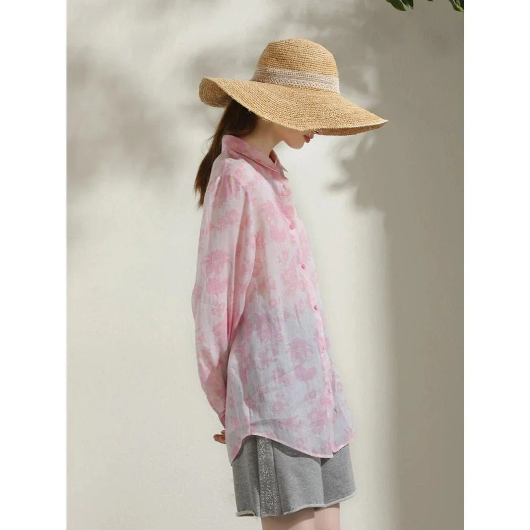 Elegant floral print ramie blouse for professional women, featuring a charming pattern, breathable fabric, and a polished silhouette.