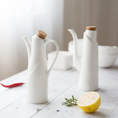 Elegant white porcelain storage bottles with Mediterranean-inspired design for kitchen organisation and decor