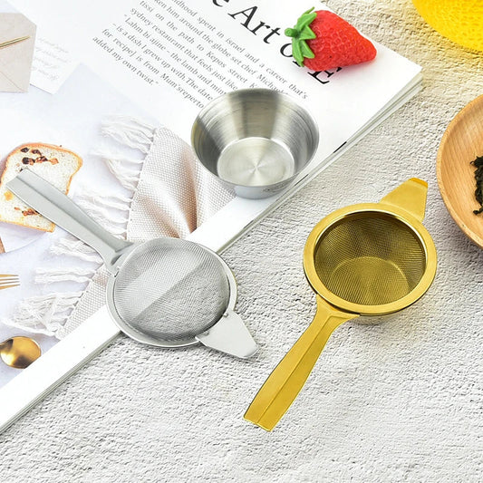 Stainless steel tea infusers with gold-tone finish in a modern, minimalist design