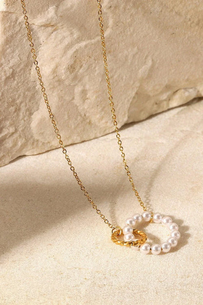 Elegant 18K gold-plated pearl hoop necklace with a lustrous synthetic pearl centrepiece
