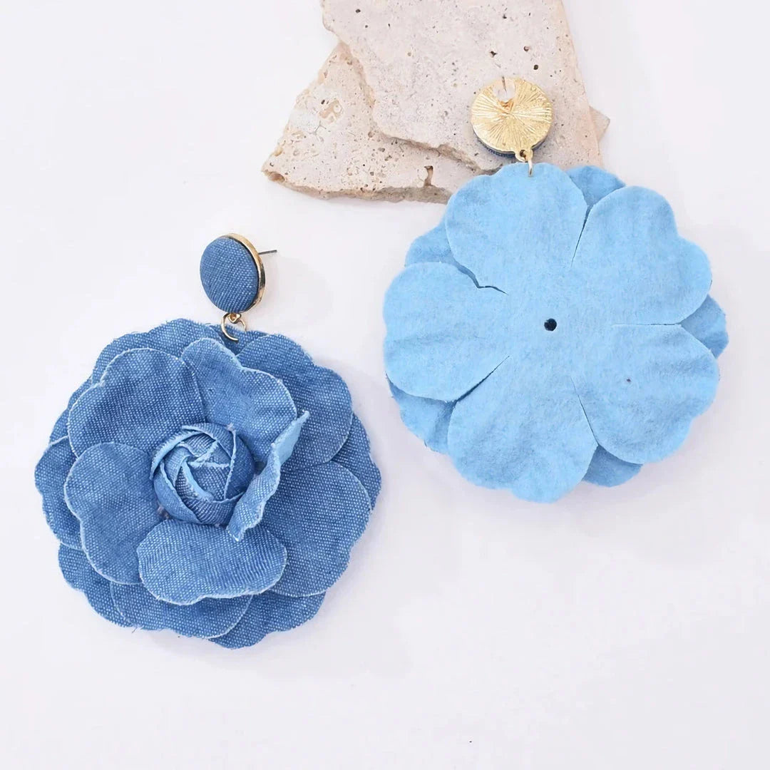Elegant denim drop earrings with intricate details, a versatile accessory that adds a touch of refined British style to any outfit.