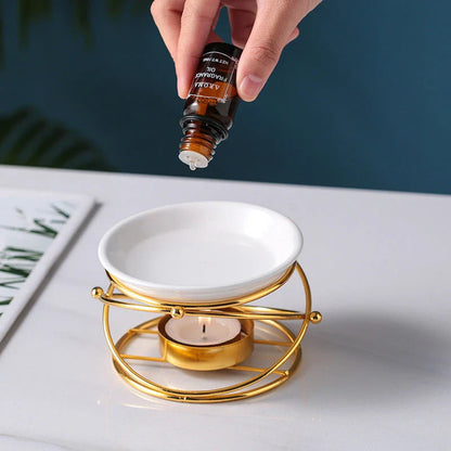 Elegant gold aromatherapy oil burner with a unique hollow-out design, creating a soothing and sophisticated ambiance in a living space