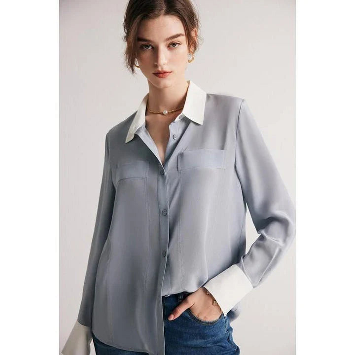 A chic and elegant silk crepe de chine blouse in a timeless solid pattern, perfect for professional and casual wear.