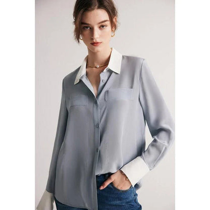 A chic and elegant silk crepe de chine blouse in a timeless solid pattern, perfect for professional and casual wear.
