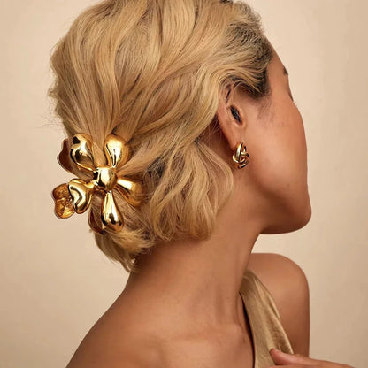 Gold floral metal hair claws - chic hair accessories for women with modern design and natural elegance