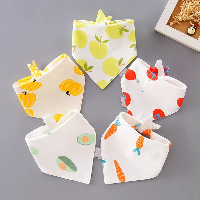 A set of fashionable cotton baby bandana bibs in various prints and colours, designed to keep your little one dry and stylish.