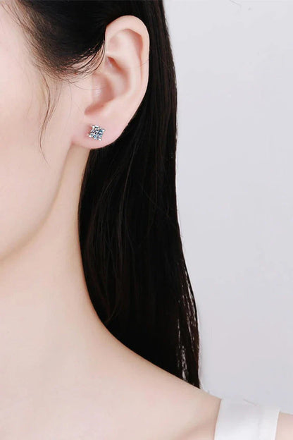 Pair of elegant 1 carat moissanite stud earrings in a minimalist silver setting, perfect for everyday wear or special occasions.