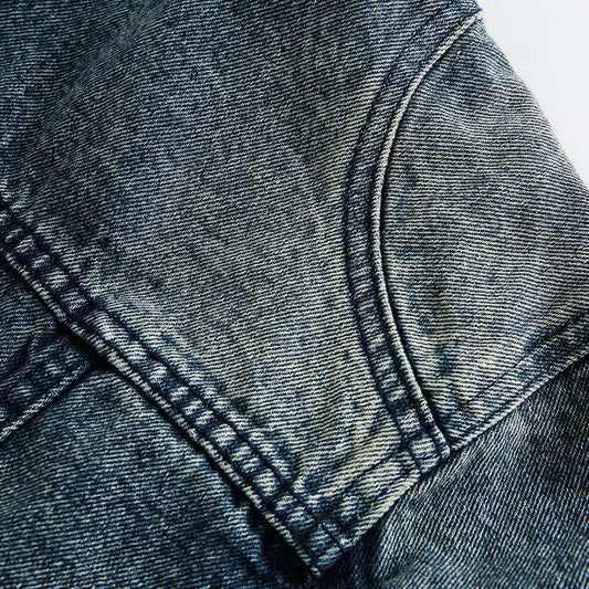 Retro-inspired men's denim jacket with intricate embroidered detailing, perfect for casual and smart-casual outfits