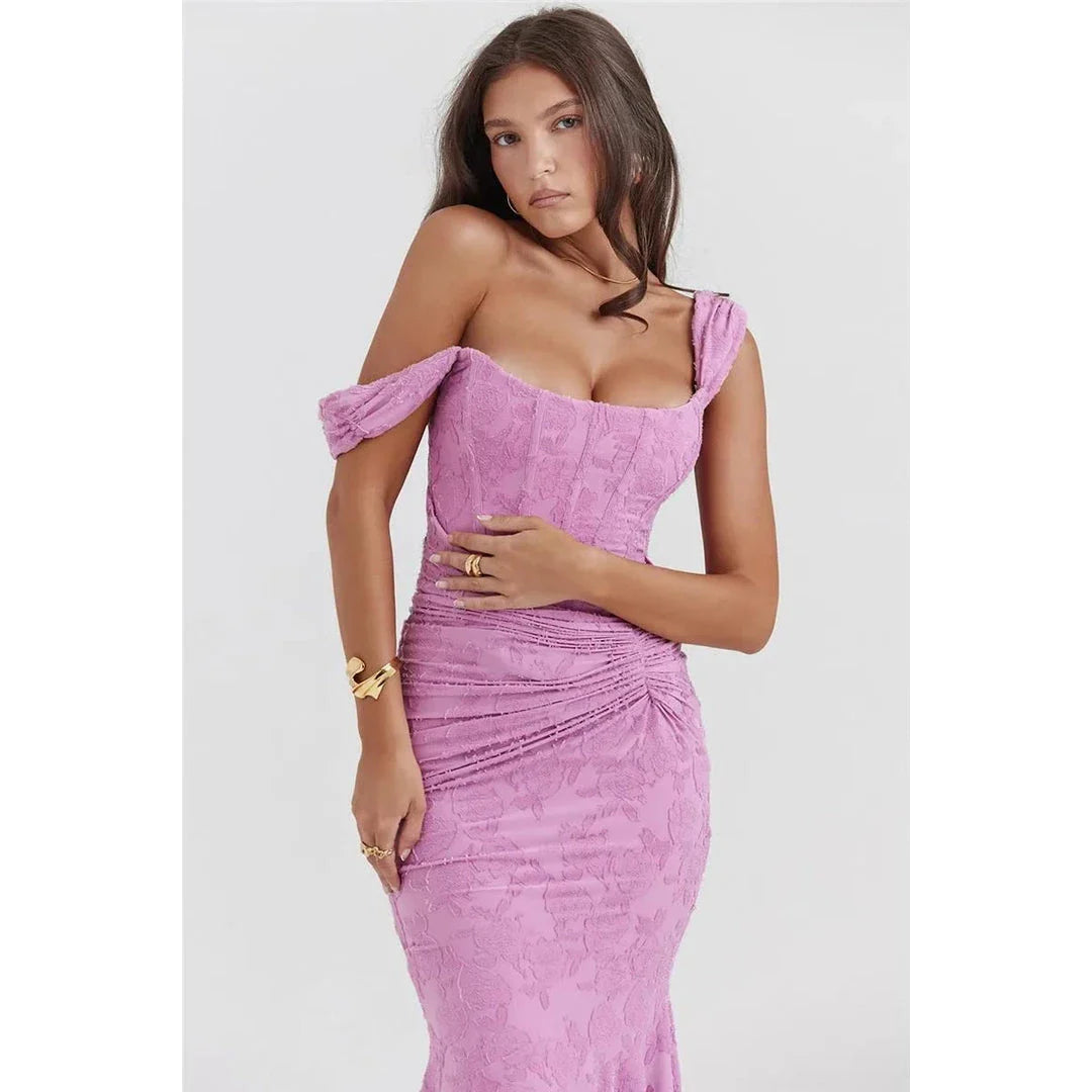 Elegant off-shoulder backless evening gown in purple, featuring ruched detailing and a flattering sheath silhouette.
