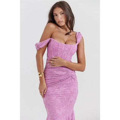 Elegant off-shoulder backless evening gown in purple, featuring ruched detailing and a flattering sheath silhouette.