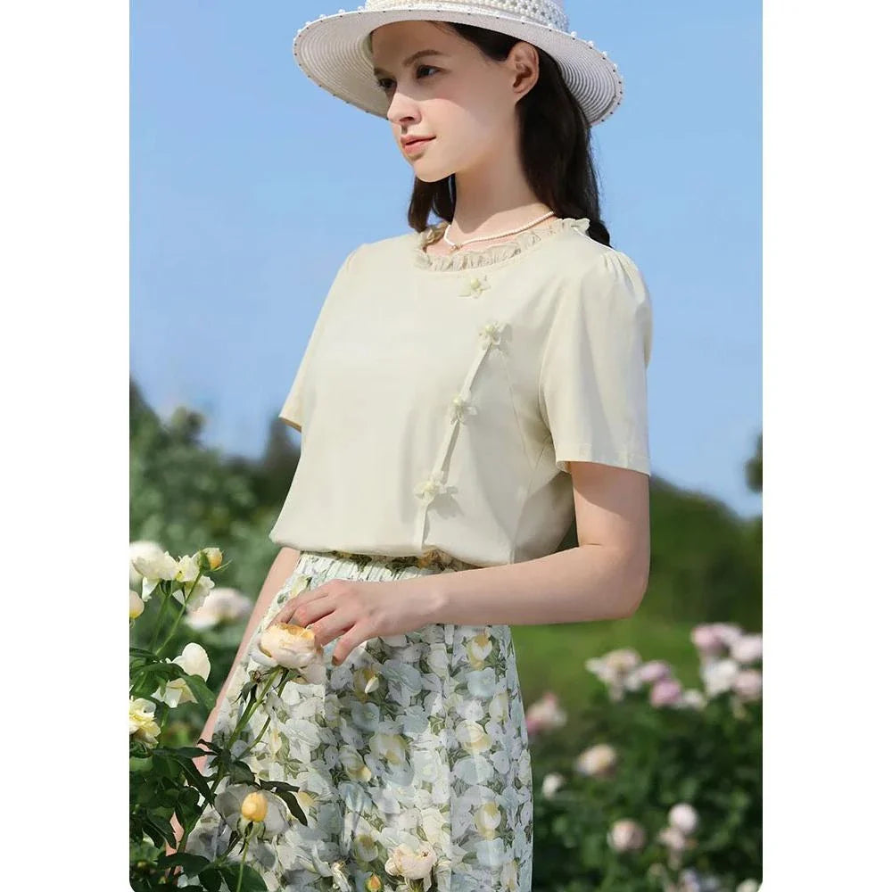 Elegant floral short sleeve t-shirt with wooden ear side detail, perfect for chic British summer style