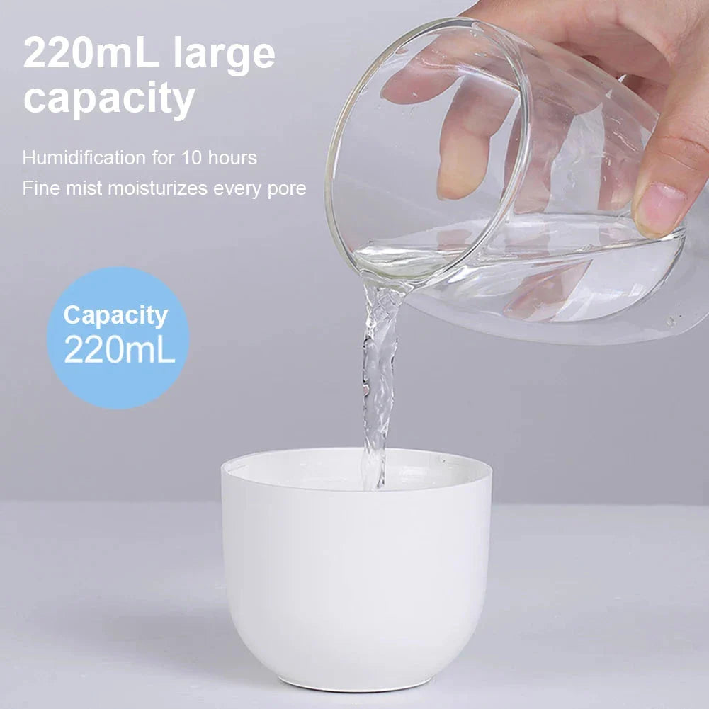 Compact ultrasonic humidifier and aroma diffuser with LED night lamp, featuring a 220 ml water tank and USB power supply