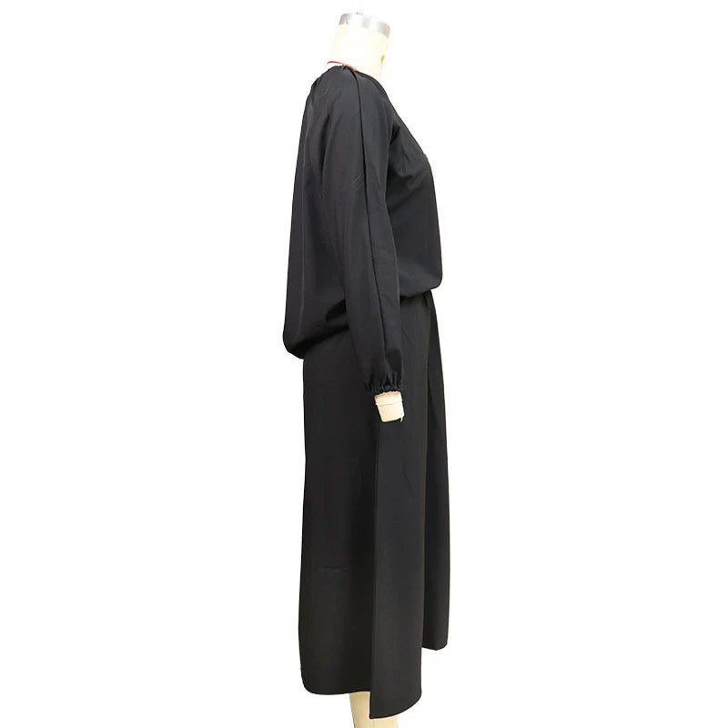 Elegant two-piece set with oblique shoulder blouse and midi skirt in black colour