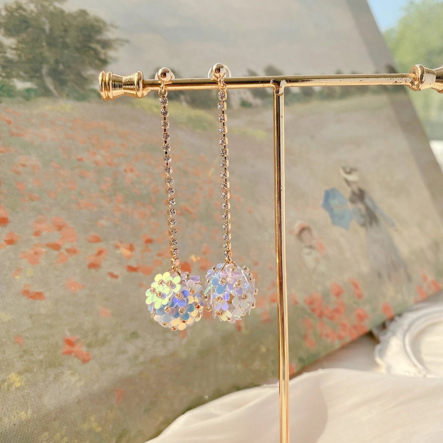 Elegant sterling silver floral drop earrings with delicate petal details, a timeless accessory for the modern British woman.