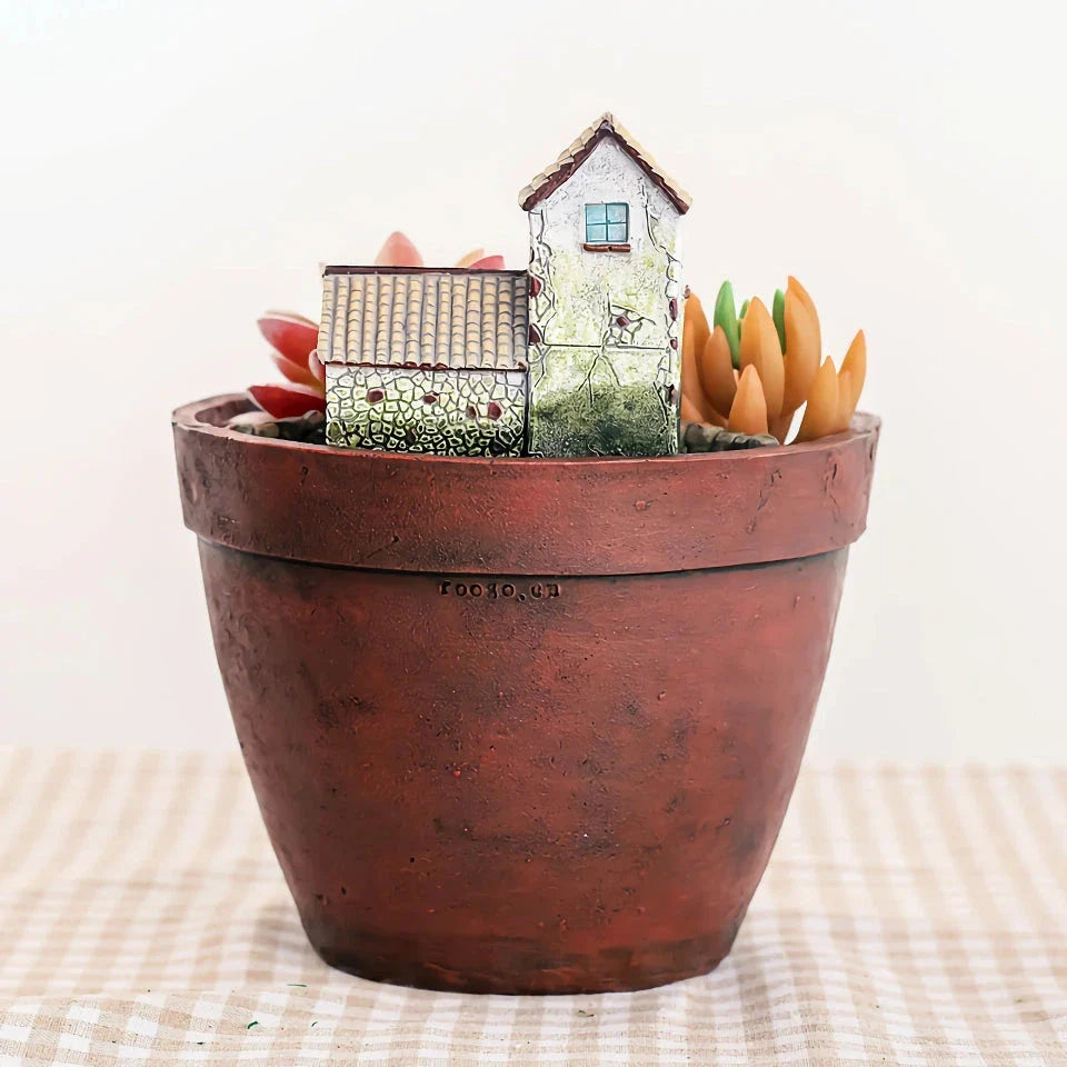 Charming farmhouse-style resin succulent planter with hand-carved pastoral design, adding rustic elegance to home or office decor
