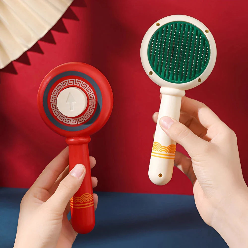 One-Click Pet Hair Removal Comb in red colour, designed to effectively remove loose fur and tangles from cat or dog coats