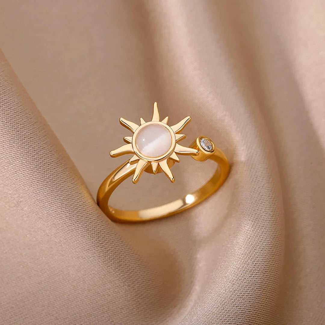 Adjustable stainless steel ring with rotating sun opal centerpiece, offering a modern and sophisticated geometric design for fashionable women
