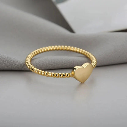 Elegant heart-shaped love ring in stainless steel and copper, a timeless and versatile piece of bridal jewellery