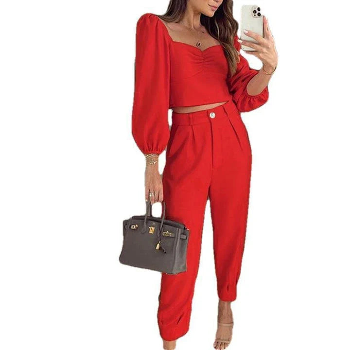 A stylish two-piece set with a square neckline top and ankle-tie trousers, made of premium polyester fabric and available in a range of vibrant solid colours.