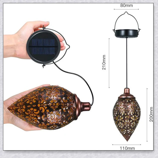 Decorative outdoor solar lanterns hanging in a lush garden, providing warm, ambient lighting