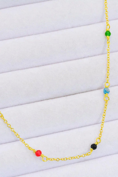 Elegant 18-carat gold-plated necklace with multicoloured beads in a minimalist, contemporary design
