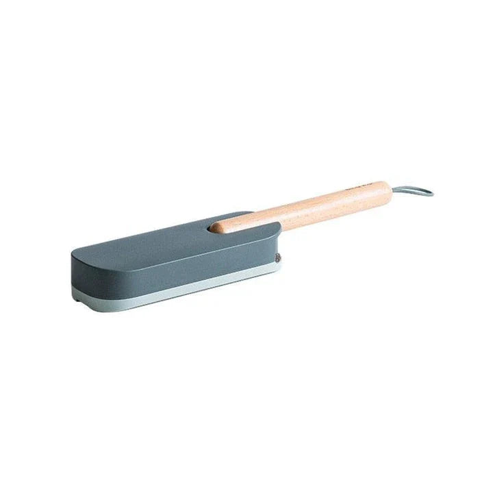 Premium pet hair removal brush with grey handle and bristles, designed for use in UK homes