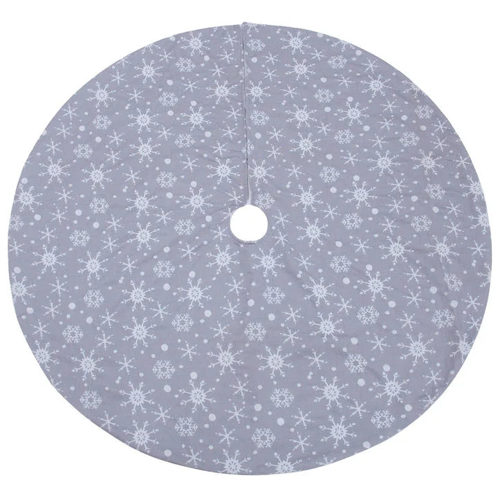 Grey background with intricate white snowflake design Christmas tree skirt