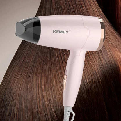 Compact foldable hair dryer with powerful 950W motor, adjustable settings, and lightweight, portable design for travel and student use