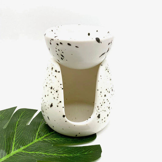 Elegant white porcelain essential oil diffuser with a minimalist Nordic-inspired design, perfect for creating a calming ambiance in your home