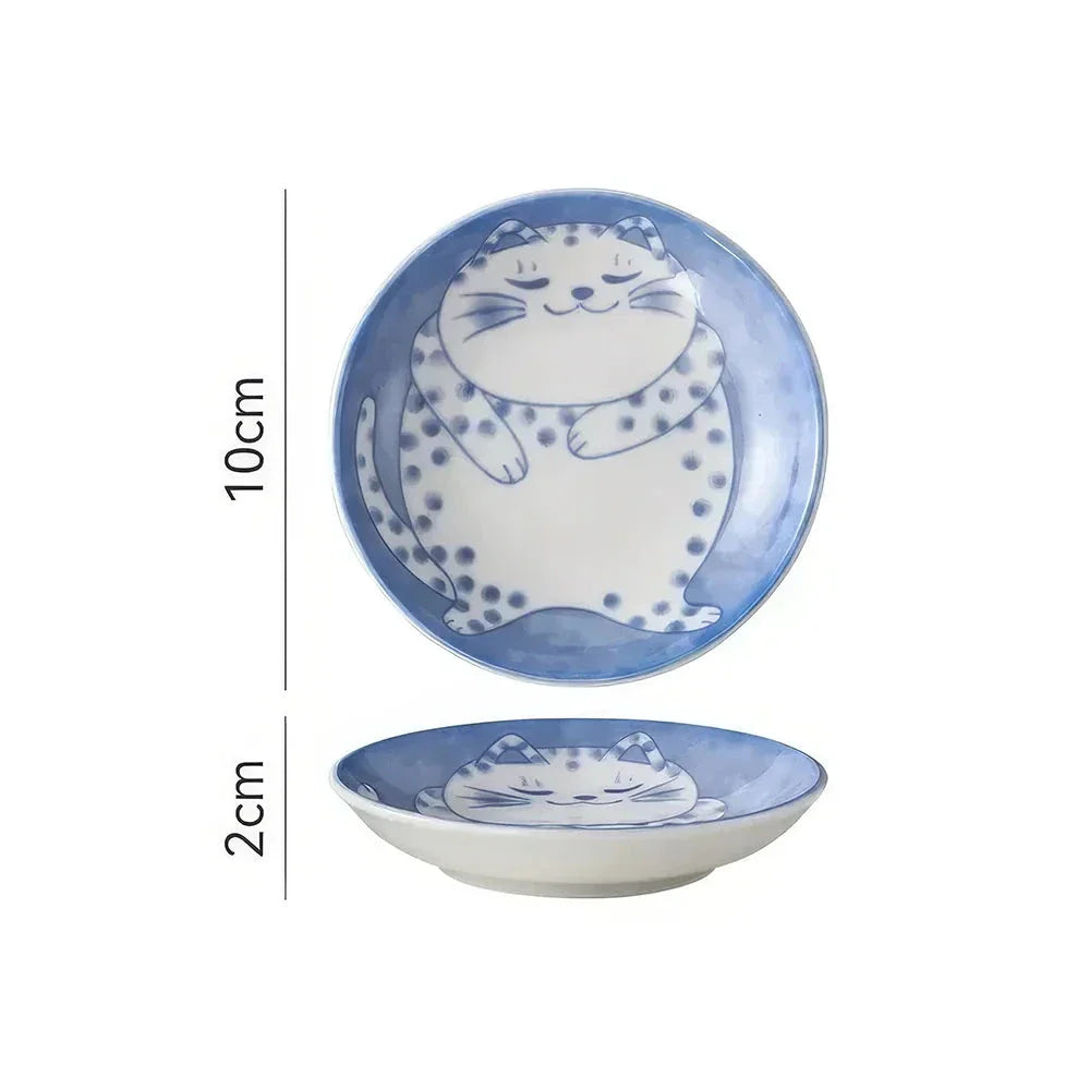 Charming Japanese ceramic sauce dish with a lucky cat design, perfect for serving sauces, sushi, and more.