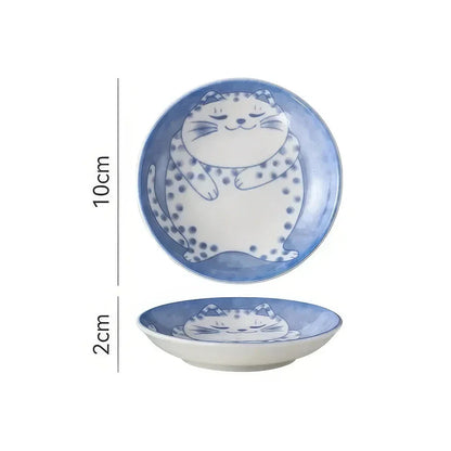 Charming Japanese ceramic sauce dish with a lucky cat design, perfect for serving sauces, sushi, and more.