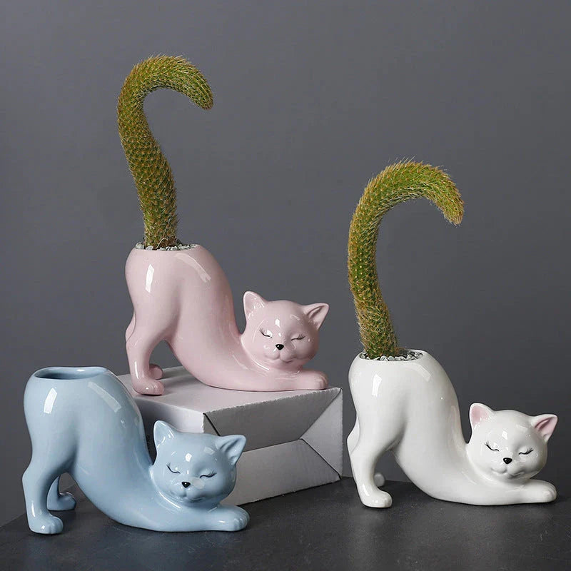 A charming cartoon cat-shaped flower pot made of high-quality glazed porcelain, perfect for adding a playful touch to your home or office decor.