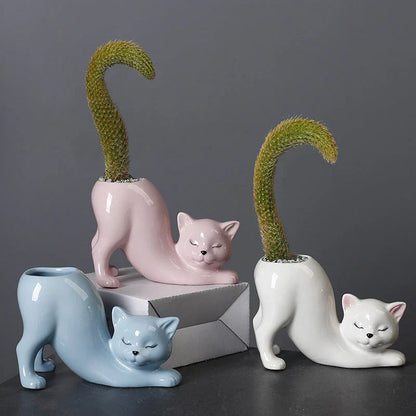 A charming cartoon cat-shaped flower pot made of high-quality glazed porcelain, perfect for adding a playful touch to your home or office decor.